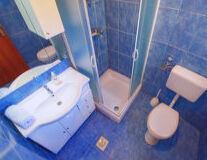 bathroom, indoor, sink, bathtub, plumbing fixture, shower, tap, toilet, bathroom accessory, mirror